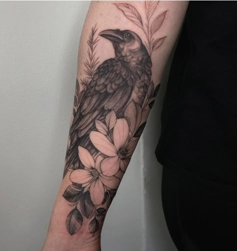 Raven And Lily Tattoo, Corvid Tattoo, Raven Tattoo Feminine Arm, Raven Tattoo Meaning, Raven Tattoo Ideas, Blackbird Tattoo, Falcon Tattoo, Kings Daughter, Tattoos And Their Meanings