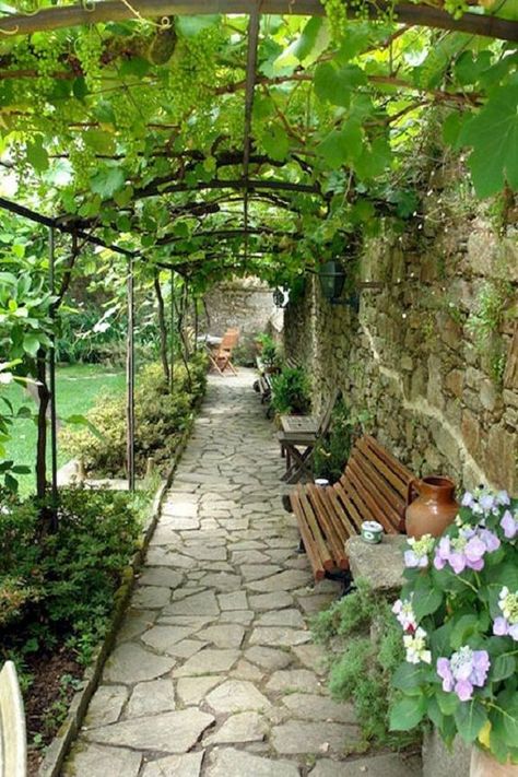 If you have a long pathway, you can create a pergola to have a shaded place to sit and relax. to make sure it gives a relaxing vibe, add plants with every bench.#pergoladesigns   #pergoladesignideas #pergoladesignideen  #pergoladesignplansideas Sidewalk Landscaping, Cobblestone Walkway, Moderne Have, Walkway Landscaping, Walkways Paths, Garden Vines, Garden Arbor, Garden Walkway, Backyard Pergola