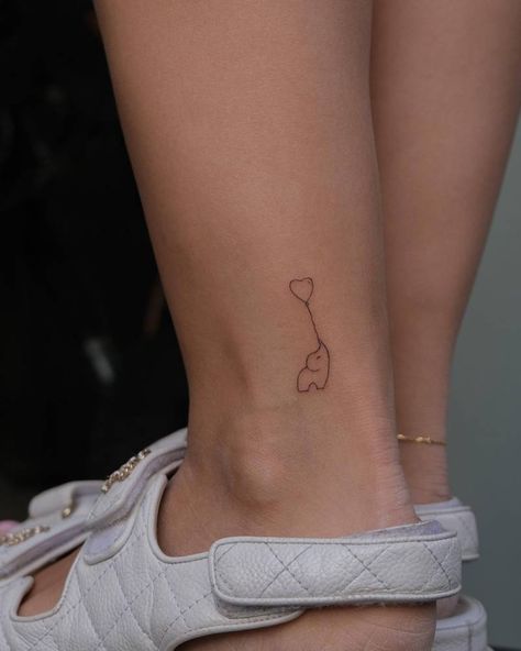 Minimalistic style elephant and heart balloon located Elephant Holding Balloon Tattoo, Fine Line Balloon Tattoo, Heart Balloon Tattoo, Balloons Tattoo, Line Animals, Tiny Tattoos For Women, Balloon Tattoo, Pretty Hand Tattoos, Its A Girl Balloons