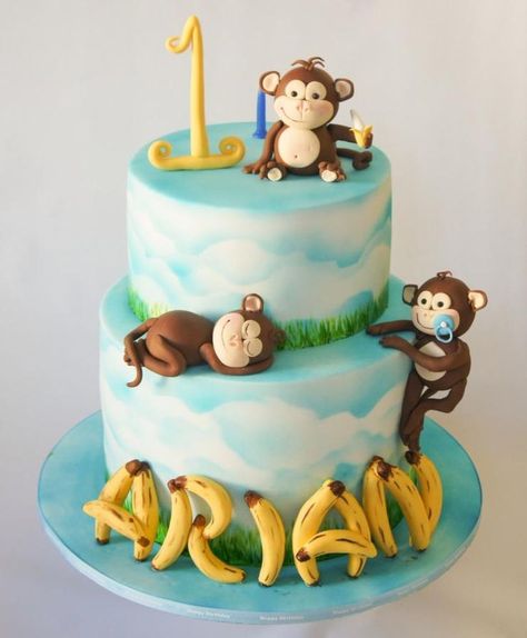 A birthday cake requested to have monkeys and bananas and blue and white colours. Monkey And Banana Cake, Monkey First Birthday Cake, Monkey Theme Birthday Cake, Monkey Theme Cake, Monkey Birthday Cakes, Red Velvet Birthday Cake, Rodjendanske Torte, Cake Designs For Kids, Monkey Birthday Parties