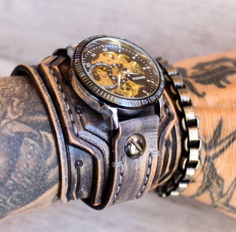 Steampunk Watch, Men's leather cuff watch, Leather Wrist Watch, Men's watch, Bracelet Watch, Gray Leather watch band, 3rd Anniversary gift Each item is handmade and designed by Cuckoo Nest Art Studio™. The watch bands made from vegetable tanned leather what is known as the highest quality leather available and used for high-end handmade leather goods. Usually, this kind of leather is stiff in the beginning however, it does get wonderfully soft and pliant over time. Vegetable tanned leather provi Leather Watch Cuff, Skull Watch, Steampunk Leather, Steampunk Watch, Mens Cuff, Mens Watches Leather, Biker Jewelry, Ormond Beach, 3rd Anniversary