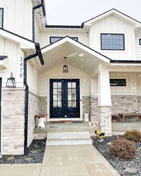 House Entrance Design Front Porches, Modern Farmhouse Outside Paint Colors, Black White Stone Exterior, Alabaster And Black Exterior, White House With Iron Ore Trim, White House Black Trim With Rock, White Brick Siding Exterior, Black And White House Front Door Color, Replacing Brick With Stone Exterior