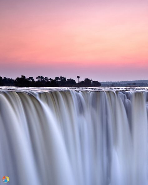 Victoria Falls, Zambia   The Falls are 1,708 metres wide and 108 metres high.  While known as the world’s largest waterfall Victoria Falls is neither the highest (Angel Falls) nor the widest (Khone Falls). However, it is the largest curtain of falling water on the planet, one and a half times wider than Niagara Falls and twice as high. Zimbabwe Victoria Falls, Victoria Falls Aesthetic, Zimbabwe Aesthetic, Zimbabwe Wedding, Victoria Falls Zambia, Victoria Falls Zimbabwe, Angel Falls, Waka Waka, Falling Water