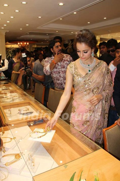 Kangana Ranaut checks out designs at a Jewelry Store Launch Sequence Work Embroidery, Kangana Ranaut, Net Saree, Jewellery Store, Peach Color, Embroidery Work, Jewelry Store, Short Sleeve Blouse, Jewelry Stores