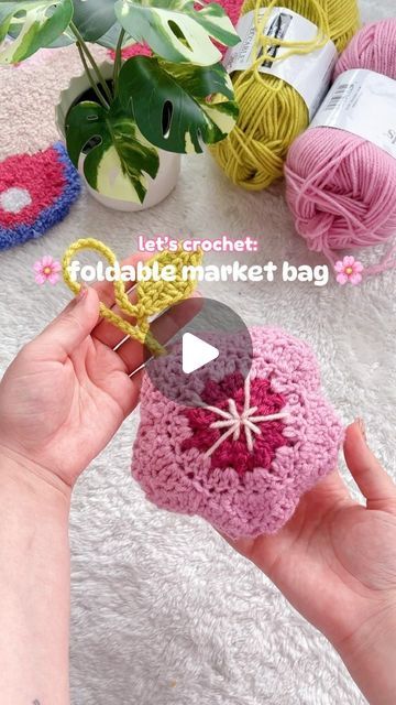 ✿ sol ✿ on Instagram: "The weather is warmer and the cherry blossoms are in full bloom! 🌸 As someone who constantly forgets her reusable bags at home, I wanted to make this adorable foldable market bag to take on my errands with me! ✨💕 (my favourite part is the little leaf 🌱) #MichaelsMakers 

materials used: Loops & Threads Impeccable yarn from @michaelsstores

Be sure to follow @Michaelsstores for more crochet inspo and share how you #MakeitwithMichaels ♡ 

__________🤍__________ 
#crochetersofinstagram #crochetlove #crochetinspo #trendingreels #crochetreels #sundropsol #cherryblossoms #springprojects #everythingtocreateanything" Crochet Fold Up Market Bag, Foldable Bag Crochet, Crochet Folding Market Bag, Foldable Market Bag Crochet Pattern, Crochet Foldable Market Bag Free Pattern, Crochet Foldable Market Bag, Foldable Market Bag, Market Bag Crochet, Crochet Market