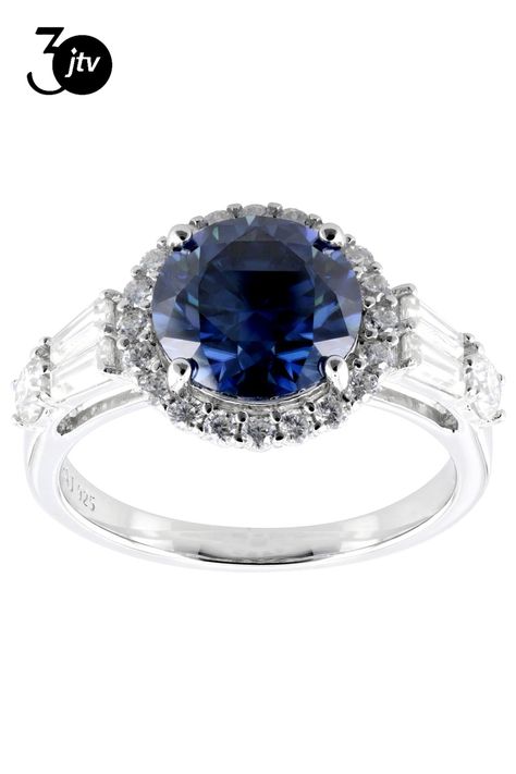 Moissanite Fire�� and navy blue moissanite 3.66ctw diamond equivalent weight round brilliant and tapered baguette, Platineve�� halo ring. Measures approximately 7/16" L x 1/16" W and is not sizeable. Actual moissanite weight is 3.00ctw. Blue Moissanite, Moissanite Jewelry, Halo Ring, Halo Rings, Round Brilliant, Halo, Navy Blue, Navy, Ring