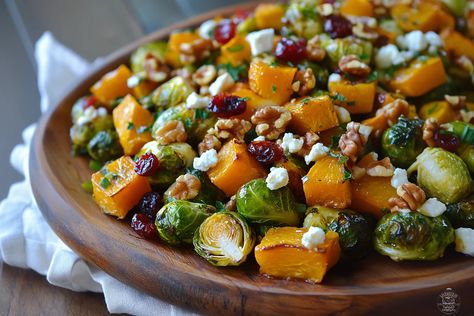 Discover the perfect fall dish: roasted Brussels sprouts and butternut squash with maple walnuts, cranberries, and goat cheese! Brussel Sprout Butternut Squash Goat Cheese, Roasted Brussels Sprouts And Maple Cinnamon Butternut Squash, Roasted Butternut Squash Brussel Sprouts Goat Cheese, Brussels Sprouts Butternut Squash Goat Cheese, Butternut Squash Brussel Sprouts Roasted Maple, Squash Brussel Sprouts Cranberries Feta, Brussel Spouts And Butternut Squash, Squash And Brussel Sprouts Recipes, Butternut Squash And Brussels Recipes