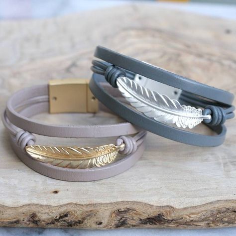 These pretty bracelets are made using strands of real leather, decorated with a gorgeous feather charm. Available in two fashionable colourways.You can choose from a dark grey leather with silver feather or light brown leather and gold feather. DARK GREY CURRENTLY OUT OF STOCKThese pretty bracelets would make a thoughtful gift for someone special one or a lovely treat for yourself! Fastened with a coordinating magnetic clasp. DARK GREY CURRENTLY OUT OF STOCK We are happy to send your order di... Silver And Leather Bracelet, Bracelets Leather Women, Silver Leather Jewelry, Wire Charm, Pandora Leather Bracelet, Leather Bracelets Women, Trending Items, Feather Bracelet, Leather Jewellery