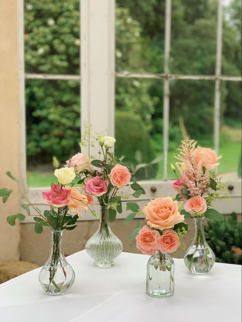 Flowers for the welcoming guests table. #syonpark #syonwedding #peachroses #weddingflowers #budvases #londonflorist Wedding Table Posy, Small Posy Floral Arrangements, Small Table Flowers, Petals And Prosecco Centerpieces, Flower Jars Decoration, Simple Flower Arrangements For Table, Flower Vase On Table, Small Flower Arrangements For Tables, Flowers In Small Vases