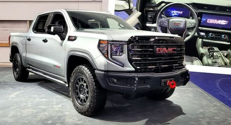 The AT4X AEV Edition boasts steel bumpers, skid plates, and 33-inch tires. At4x Aev, 2023 Gmc Sierra, Goodyear Wrangler, Black Door Handles, Chevy Colorado, Expedition Vehicle, Gm Trucks, Lamborghini Huracan, Infotainment System