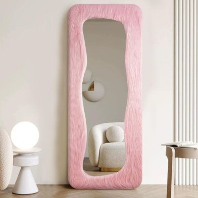 Wave Design: Featuring a sleek and enduring design, this wavy full length mirror captivates with its minimalist yet enduring wave shape. It serves as a focal point that seamlessly blends into various interior decor styles, adding a touch of charm to any room. Ivy Bronx | Ivy Bronx Madielynn Solid Wood Wall Mirror in Pink | 63" H X 24" W | Wayfair | Home Decor Squiggle Mirror, Wavy Mirror, Wave Wall, Large Wall Mirror, Pink Mirror, Wood Wall Mirror, Cute Bedroom Decor, Length Mirror, Photoshoot Inspo