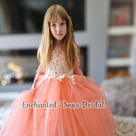 Coral Flower Girl Dress, Princess Dress -Link in bio. Flower Girl Dress in Coral, Ivory, Champagne or any colour you choose. Please message me. 🌹 A beautiful floor length tulle flower girl dress with a full tulle skirt to make your little girl feel like a true princess. This dress is made from the finest materials with exquisite embroidery and lace applique on the sleeves and front of the dress Finished with a large fluffy tulle bow, with a zip and buttons up the back. Available in Coral... Coral Flower Girl Dresses, Tulle Flower Girl Dress, Tulle Bow, Full Tulle Skirt, Coral Flower, Tulle Flower Girl, Tulle Bows, Flower Girl Dresses Tulle, Dress Princess