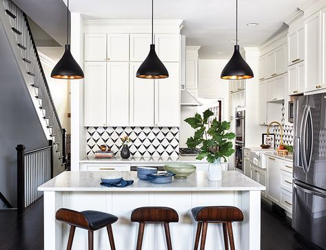 The kitchen of a row house in DC was reimagined into a stylish space. Bold @annsacks backsplash tile adds a classic touch. Pendants from @circalighting feature gold interior; stools from @articlemodern complete the look. Design: Studio Miel 📸: Stacy Zarin Goldberg #kitcheninteriors #kitchendesign #interiordesign #design #kitcheninspiration #classic #dcinteriors #dcdesign #ideabook #homeanddesigndc Row House Kitchen, Cramped Kitchen, Tiny House Interior Design, Home Design Magazines, Small Wonder, Kitchen Storage Solutions, Tiny House Interior, Gold Interior, Row House