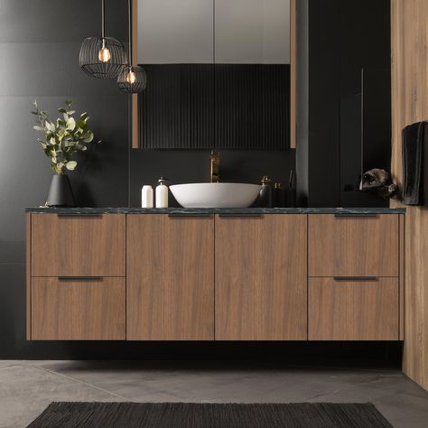 Transform your bathroom with the bold and elegant combination of wood and black. This striking duo brings together the warmth of wood and the sophistication of black, creating a space that exudes elegance, power, and modern luxury. It's the perfect vibe for those who want a bathroom that makes a statement. Shaving cabinet: McLaren Range Vanity cabinet: Sicily Range Doors and Panels: Polytec - Florentine Walnut - Woodmatt Finish - 16mm Benchtop: Duropal - Nero Portoro - Matte Special - 3... Black And Wood Bathroom, Black Bathroom Cabinets, Black Cabinets Bathroom, Shaving Cabinet, Wood And Black, Floating Vanity, Wood Bathroom, Bathroom Inspo, Bathroom Cabinets