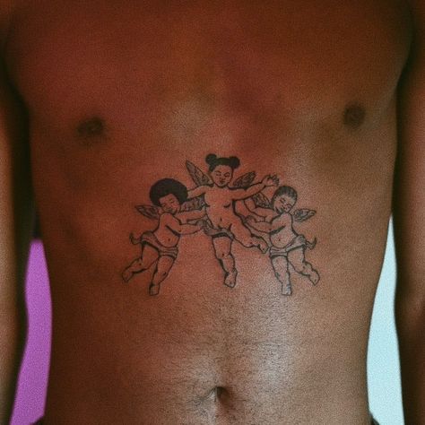 30 Beautiful Tattoos On Dark Skin | Tattoodo Afro Tattoo, Black People Tattoos, Angle Tattoo, Baby Angel Tattoo, Dark Skin Tattoo, Cupid Tattoo, Cherub Tattoo, African Tattoo, Tattoos Mandala