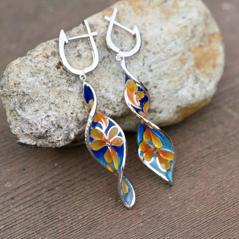 "I am no longer working with enamel so grab these while you can!! ( too many cheap copies of my work out there )- Hand Enameled - Colorful Plumeria design - Sterling Silver 925 - Cubic Zirconia - 13mm wide x 55mm ( 2.15\" ) long from top of design to bottom. This earring was inspired by my love for Hawaii. These are made with gorgeous hand enameling and tiny, sparkling cubic zirconia embedded into the edges. This is a fairly long earring that will stand out. These would make perfect earrings for a tropical wedding. The meaning behind plumeria is beautiful and fitting to give as a gift to your special someone: Plumeria Symbolism: Dedication Devotion Positivity I am inspired by nature so you will see quite a few flower pieces in my shop. These will come in a pretty gift box. IMAGES Please no Plumeria Design, Flower Earrings Gold, Long Earring, Animal Earrings, Enamel Earrings, Delicate Jewelry, Tropical Wedding, Pretty Gift, Enamel Jewelry