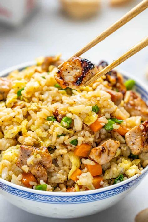 Homemade Pork Fried Rice recipe is a game changer for weeknight meals. Perfectly cooked pork and fluffy, crispy rice mix with colorful vegetables for an irresistible taste. It's easy to make and a must-try meal the whole family will love! Pork And Rice Casserole, Pork And Rice Recipes, Pork Fried Rice Recipe, Rice Meals, Pork Dinners, Stay At Home Chef, Recipes Pork, Pork Fried Rice, Sausage Dishes