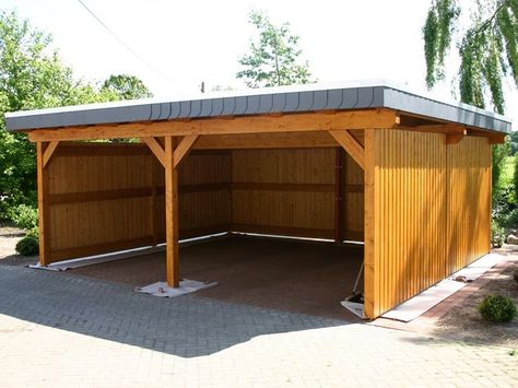 Not everyone wants a garage or all of the requirements it takes to build one as every city has different requirements, but perhaps you still desire something to cover your car, and still looks attractive in your yard. Options and inspirations reach to an attached carport, one that has an open design, or even a... Read More Prefab Garage Kits, Attached Carport, Wooden Carports, Building A Carport, Prefab Garages, Carport Ideas, Diy Carport, Carport Plans, Carport Sheds