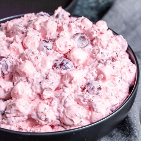 This Creamy Cranberry Salad, otherwise known as Cranberry Fluff, is a delicious combination of fresh cranberries, red grapes, pineapple, marshmallows, and pecans all tossed together in Cool Whip. This easy cranberry salad can be served as a Thanksgiving or Christmas side dish or dessert. I classic southern holiday recipe that the whole family will love. #cranberry #cranberries #thanskgiving #christmas #homemadeinterest Southern Holiday Recipes, Cranberry Fluff, Cranberry Salad Recipes, Vegetarian Holiday Recipes, Christmas Salad Recipes, Southern Thanksgiving Menu, Best Thanksgiving Side Dishes, Christmas Side, Homemade Stuffing