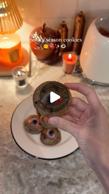 Sheri Wilson on Instagram: "Spooky Eyeball Cookies 🎃🍪 the perfect spooky season treat! These are so easy to make- the middle tastes kind of like a strawberry poptart! 

Spider Shirt 🕷️(Natasha Top)- @hellbunnyofficial 

-chocolate chip cookie dough (store bought or homemade)
-gummy eyeball candies

Bake the cookies at 350F for about 6-8 minutes. While they are still slightly gooey, slice into the middle and add a gummy eyeball to each one.

#spookyseason #cookies #halloweentreats #halloweenaesthetic #halloweenmood #halloweenvibes #halloweencountdown #autumnvibes" Eyeball Brownies, Eyeball Cookies, Brownie Eyeballs, Eyeball Cupcakes, Eyeball Candy, Halloween Edible Eyeballs, Halloween Jell-o Shots Eyeball, Halloween Countdown, Halloween Eyeballs