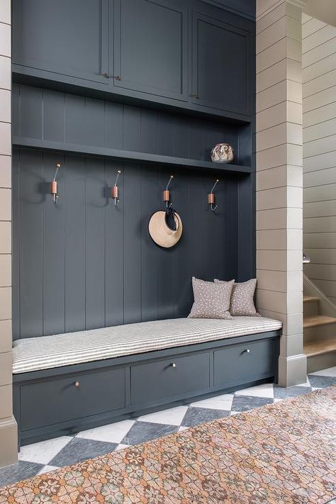 Blue mudroom bench on a gray and black checkered floor in a transitional foyer. Black Checkered Floor, Blue Mudroom, Contemporary Hamptons, Drop Station, Cortney Bishop, Drop Zones, Transitional Laundry Room, Checkered Floor, Mudroom Cabinets