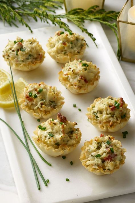 Cheesy Crab Stuffed Phyllo Cups recipe. Decadent and creamy crab filling in crispy phyllo cups. The perfect, bite-size party food for your next gathering. Philo Cups, Crab Appetizer, Tastefully Simple Recipes, Gourmet Appetizers, Phyllo Cups, Creamy Crab, Crab Stuffed, Roasted Onions, Tastefully Simple