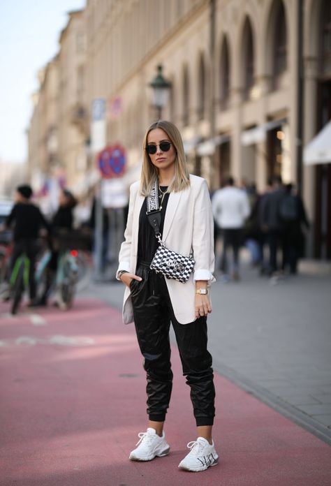 MUNICH, GERMANY - MARCH 24: Christina Bischof (@christinabiluca) wearing Mango blazer, Zara leather pants, Valentino sneaker, Dior bag, black shirt from & other stories, kapten & son sunglasses and Black Palms chain on March 24, 2019 in Munich, Germany. (Photo by Jeremy Moeller/Getty Images) Valentino Sneakers Outfit Women, Leather Pants Sneakers Outfit, Valentino Sneakers Outfit, Leather Trousers Outfit, Leather Pants Style, Zara Leather Pants, Mango Blazer, Valentino Sneakers, Trousers Outfit