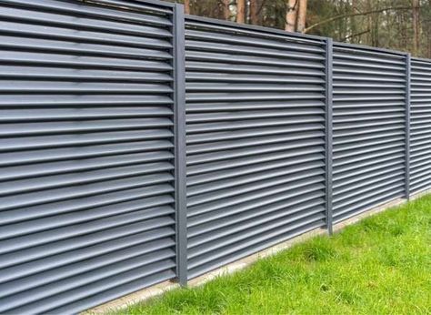 Cheap Fence Ideas: 18 Frugal Ways to Enclose Your Property - Bob Vila Corrugated Metal Privacy Fence, Metal Fence Ideas Steel, Diy Metal Fence, Metal Fence Design, Metal Fence Ideas, Metal Privacy Fence, Cheap Privacy Fence, Fence With Lattice Top, Dog Ear Fence