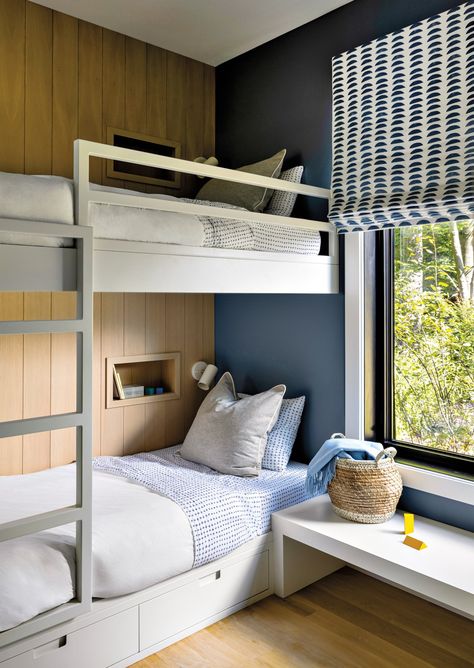 Extra-long twin beds in the charming bunk room allow adults to sleep as comfortably as the kids. The Shade Store used Rebecca Atwood’s Hills fabric to craft the Roman shade. Bunk Bed Niche, Small Bunk Room, Bunk Beds Design, Boys Room Bunk Beds, Bunk Beds For Adults, Room With Bunk Beds, Bunk Room Ideas, Bunk Beds For Boys Room, Tiny Dining Rooms