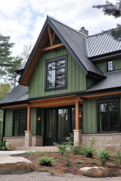 Green and black modern house with tall gables. These Scandinavian modern houses are a hug of architecture — a sleek, nordic sanctuary with a dash of whimsy. Modern Farmhouse Green Exterior, Green Mountain Home Exterior, Dark Green Siding House, Green And Black House, Green House With Black Trim, Green House Black Trim, Modern Farmhouse Green, Dark Green House, Dark Green House Exterior