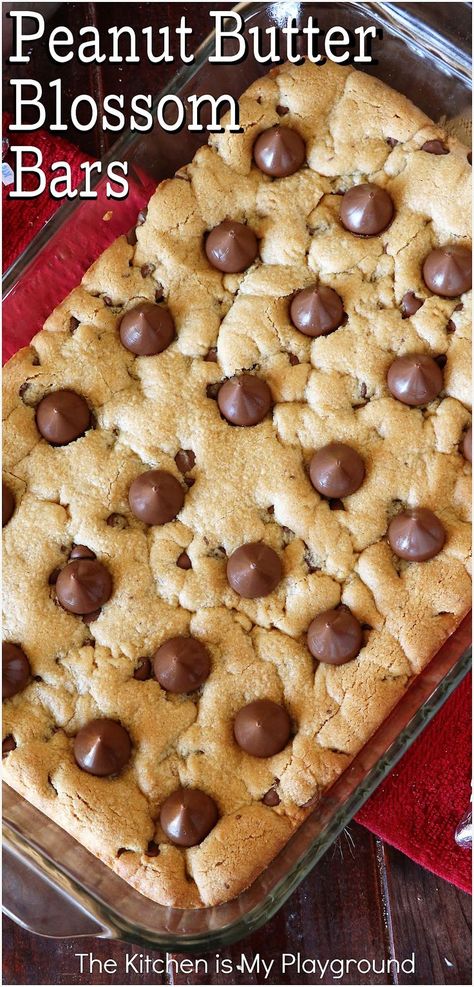 Top view of a pan of Peanut Butter Blossom Bars Cookie Recipes Peanut Butter, The Kitchen Is My Playground, Peanut Butter Blossom, Bars Dessert, Amazing Cookie Recipes, Peanut Butter Blossoms, Dessert Bar Recipe, Dessert Aux Fruits, Peanut Butter Desserts