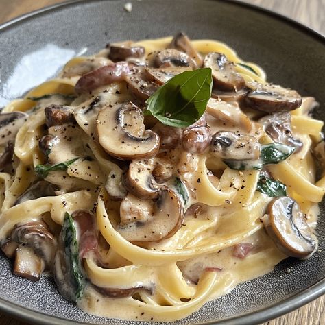 Tagliatelle Carbonara with Mushrooms 🍝🍄 Ingredients: - 300g tagliatelle - 150g mushrooms (sliced) - 2 eggs - 100g grated parmesan - 2 cloves garlic (minced) - 150ml crème fraîche - Olive oil - Salt and pepper (to taste) - Fresh parsley (to garnish) Instructions: 1. Start by bringing a large pan of salted water to the boil. Once boiling, add the tagliatelle and cook according to the packet instructions until al dente. Remember to reserve about a cup of the cooking water before draining the p... Tagliatelle Carbonara, Creamy Mushroom Pasta, Mushroom Pasta, Jambalaya, Sliced Mushrooms, Couscous, Minced Garlic, Tasty Dishes, Pasta Recipes