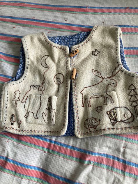 handmade and embroidered childs waistcoat approx age 4/5 . fully lined in vintage cotton fabric . the wool is a recycled vintage blanket . embroidered with whimsical animals . measures pit to pit  15 inches ,length 12 inches . toggle fastenings a useful extra layer . boxy shape . Whimsical Animals, Wool Waistcoat, Embroidered Blanket, Embroidered Vest, Dress Up Boxes, Sewing School, Recycled Clothing, Vintage Blanket, Embroidered Wool