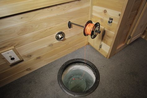 The 10 fishing holes are carved right into the floor. Built-in holders for Mr. Larson's rods and rattle reels allow him to fish while he mixes cocktails at the countertop bar, or plays a hand of poker. Ice Fishing Shanty, Fishing In Alaska, Ice Hut, Fish Hut, Hut Ideas, Ice Shanty, Ice Fishing Shack, Ice Fishing House, Ice Fishing Gear