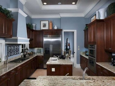 kitchen cabinet colors for blue walls - Google Search Popular Kitchen Colors, Blue Kitchen Walls, Stove Ideas, Dark Brown Cabinets, Dark Wood Kitchens, Brown Cabinets, Kitchen Wall Colors, Kitchen Colour Schemes, Dark Kitchen