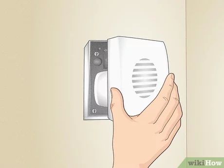 3 Ways to Cover a Doorbell Chime - wikiHow Hide A Doorbell Chime, Door Chime Cover, Door Bell Chime Cover, Diy Doorbell, Doorbell Cover, Doorbell Chime, Inside Door, Electrical Panel, Stud Walls