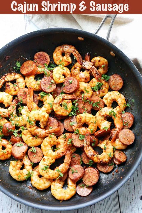 Ready in just 30 minutes, this shrimp and sausage recipe is ideal for weeknight dinners. Serve it on top of greens or cauliflower rice for a complete meal. Conecuh Recipes, Shrimp And Smoked Sausage Recipes, Shrimp And Sausage Recipes, Cajun Skillet, Sausage And Shrimp Recipes, Garlic Herb Shrimp, Kielbasa Skillet, Lowcarb Meals, Healthy Sausage Recipes