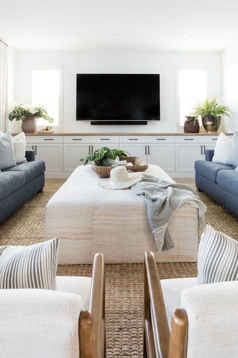 Love this beautiful modern living room design with two sofas, two mid-century modern arm chairs, a TV wall with built in cabinets, and neutral furniture and decor - living room decor - living room furniture - tv wall ideas - modern coastal decor - coastal living room - living room ideas - pure salt interiors Modern Coastal Living Room, Long Narrow Living Room, Pure Salt Interiors, Long Living Room, Narrow Living Room, Modern Coastal Decor, Living Tv, Pure Salt, Neutral Furniture