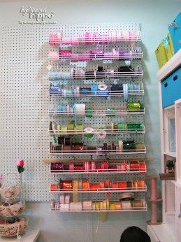 Peg Board wall and ribbon storage racks in Scrapbook Room - love how the pegboard matches the wall color so it blends in! #SmartFunDIY #CraftRoom #Scrapbookroom #craftorganizing #ribbon #pegboard Ribbon Storage On Pegboard, Storage Pegboard, Space Scrapbook, Diy Peg Board, Pegboard Craft Room, Peg Board Walls, Scrapbook Rooms, Peg Boards, Ikea Crafts