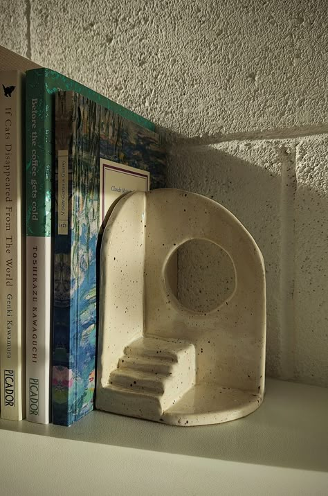 Bookend from clay modern bookend white architecture Ceramic Pottery Book Ends, Book End Ceramic, Ceramic Pieces Projects, Clay Bookshelf Decor, Clay Shelf Decor, Handmade Air Dry Clay Ideas, Ceramic Book Ends Diy, Pinchpot Clay Ideas, Pottery Book Holder