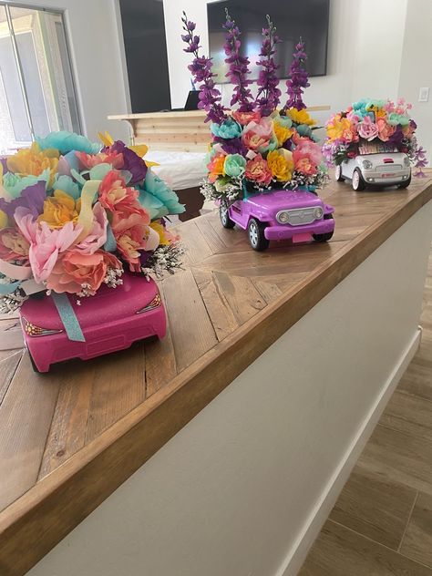 Barbie Car With Flowers, Barbie Car Flower Arrangement, Barbie Race Car Party, Barbie Theme Party Centerpieces, Barbie Floral Arrangement, Barbie Flower Arrangement, Barbie Car Centerpiece, Barbie Flowers, Barbie Brunch