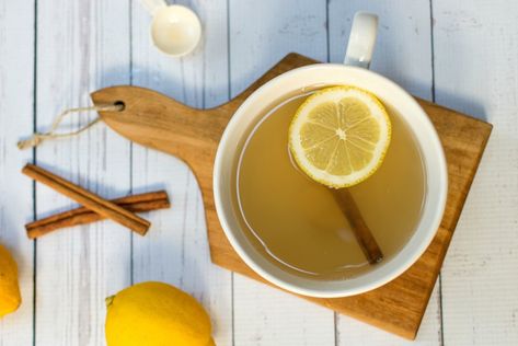 Cinnamon Lemon Detox Tea: Benefits, Recipe & More - Sips by Recipes With Ginger Root, Ginger Root Tea, Boost Metabolism Drink, Ginger Roots, Lemon Health Benefits, Lemon Detox, Drinking Hot Water, Detox Diets, Ginger Slice