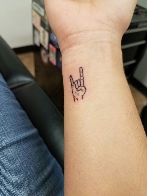 Rock Hand Symbol Tattoo, 2023 Tattoo Trends Men, Rock And Roll Hand Sign Tattoo, Rock N Roll Tattoo Small, Acdc Tattoo Small, Rock And Roll Hand Tattoo, Rock Music Inspired Tattoos, Metal Music Tattoo Ideas, Rocker Hand Tattoo