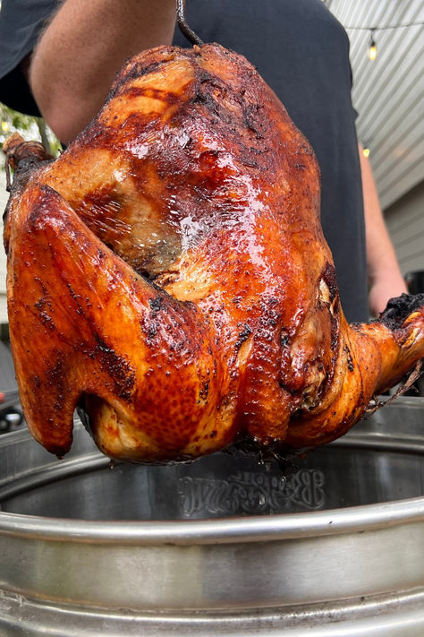 Close-up of a perfectly golden, crispy deep-fried turkey being lifted out of a fryer, showcasing its rich color and texture, ideal for Thanksgiving gatherings. Best Fried Turkey Recipe, Turkey Fryer Recipes Deep Frying, Fried Turkey Recipes Thanksgiving, Deep Fry Turkey, Cajun Deep Fried Turkey, Frying A Turkey, Turkey Fryer Recipes, Fry Turkey, Smoked Turkey Rub