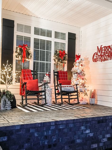 Christmas porch with nutcrackers Front Porch Nutcracker, Porch Nutcracker, Front Porch Chairs, White Rocking Chairs, Christmas Red And White, Porch Chairs, Red And White Christmas, Porch Christmas Decor, Front Porch Christmas