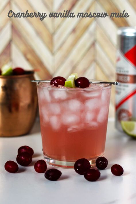 The moscow mule is a timeless cocktail, beloved for it's refreshing blend of ginger beer, lime juice, and vodka. But as the holidays roll in, why not give this classic a festive makeover? Enter the cranberry vanilla moscow mule, a drink that's equal parts tart, sweet, and spicy. With it's pretty reddish hue and rich vanilla undertones, it's perfect for everything from cozy gatherings to glitzy parties. Festive Moscow Mule, Vodka Mule Recipe, Mule Drink Recipes, Vanilla Vodka Cocktails, Vanilla Vodka Drinks, Whiskey Mule, Vodka Mule, Cranberry Moscow Mule, Drinks With Cranberry Juice