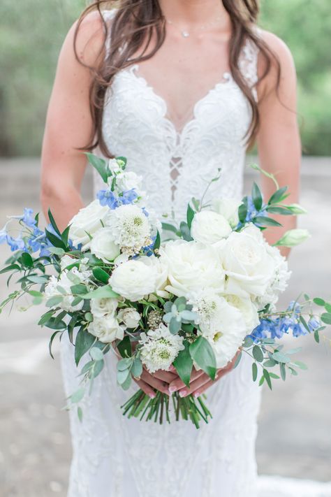 White and dusty blue wedding flowers bridal bouquet with blue delphinium and garden roses | Texas Hill Country | Angela King Photography | Planning by Sweet Laurel Events White Rose And Blue Delphinium Bouquet, Dust Blue Wedding Flowers, Blue Delphinium Bridal Bouquet, Rose And Delphinium Bouquet, White And Dusty Blue Wedding Flowers, White Bridal Bouquet With Blue Accents, White Roses With Blue Accents, Blue Delphinium Wedding Bouquet, White And Light Blue Bridal Bouquet