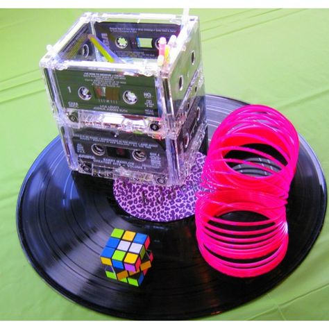 cassette tape centerpieces | 80's centerpiece's made from cassette tapes, record, slinky, and ... 80s Centerpieces Diy Table Decorations, Festa Rock Roll, 90s Party Ideas, 80's Prom, Decades Party, 80s Birthday, 80s Party Decorations, 80's Theme, 80s Birthday Parties