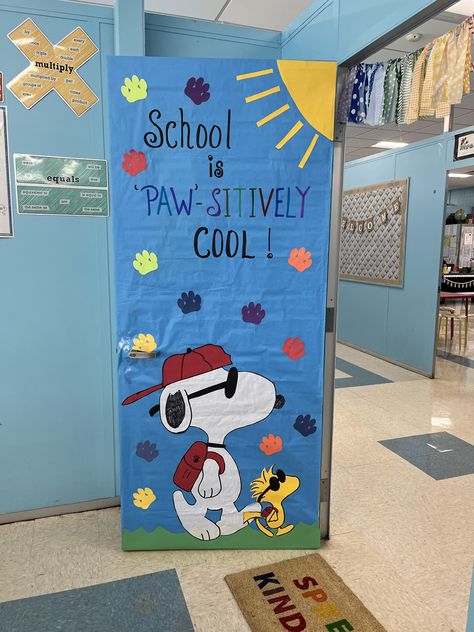 Paw Print Bulletin Board Ideas, Dog Themed Bulletin Board Ideas, Charlie Brown Classroom Door, Peanuts Classroom Decor, Snoopy Classroom Decorations, Charlie Brown Classroom Theme, Peanuts Classroom Theme, Snoopy Classroom Theme, Snoopy Bulletin Board Ideas