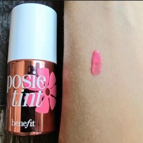 Posie Lip Tint By Benefit Benefit lip tints are the sexiest flush you can get from a bottle. A kiss-proof and smudge-proof, indelibly sheer tint, it gives a cleared yet provocative glow to keep everyone guessing. This lip and cheek stain creates radiance for your lips. The smudge-proof, liquid-gel formula imparts radiance that lasts from morning to night. It is easily blended with your fingertips for quick, fuss-free application and has a buildable texture that can be coated on for an extra ... Lip Tints, Cheek Stain, Lip Tint, Stain, Lips, Kiss, Texture, Quick Saves